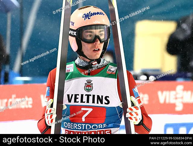 29 December 2021, Bavaria, Oberstdorf: Nordic skiing/ski jumping: World Cup, Four Hills Tournament. Stefan Kraft from Austria reacts after his jump in the...