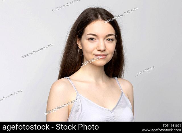 Portrait smiling beautiful young woman on white background