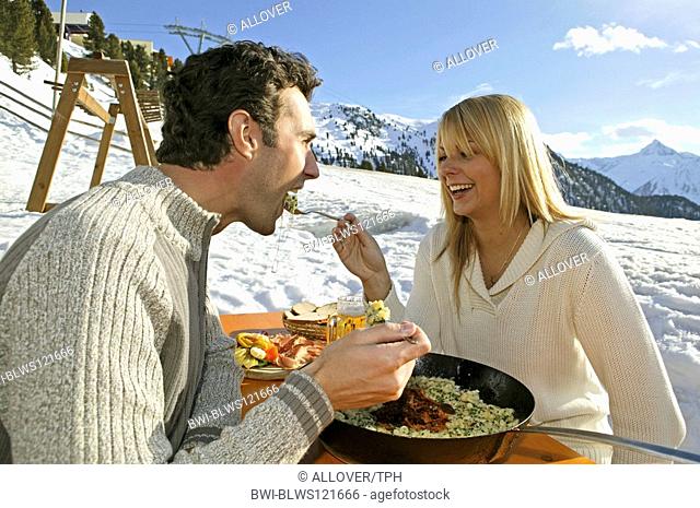 couple eating at ski hut