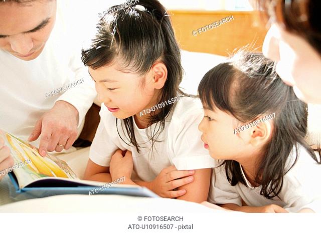 Father reading a book for children