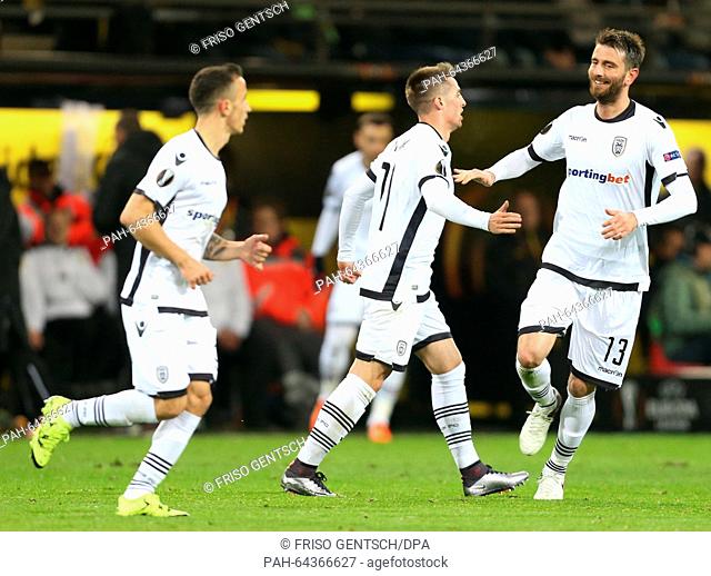 Saloniki's Robert Mak (C) and teammate Stelios Malezas (R) celebrate during the Europa League group C soccer match Borussia Dortmund vs PAOK Saloniki in...