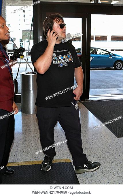 Jack Black pretends to be on phone like paris hilton as he departs LAX Featuring: Jack Black Where: Los Angeles, California