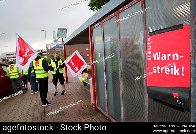 01 July 2022, Hamburg: Employees of a maintenance company at the airport take part in a warning strike near the South Gate