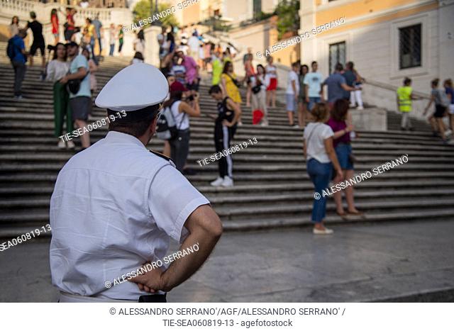 Municipal Police invites people sitting on the steps of Trinita' dei Monti, in Piazza di Spagna to stand up, Rome, ITALY-06-08-2019