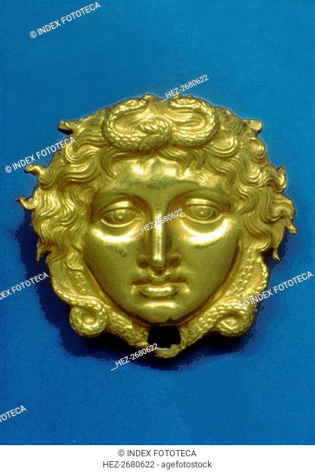 Head of the Gorgon Medusa in embossing gold, piece from the royal tomb at Vergina (350 BC)