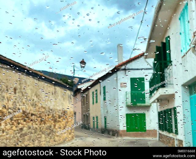 Luna street viewed through a wet glass. Lozoya, Madrid province, Spain