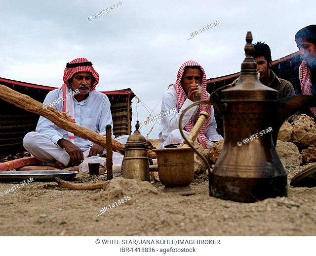 Bedouins at breakfast, tea and Gabouri bread baked in ashes, desert peoples from Egypt meeting in Wadi el Gamal National Park, Valley of the Camels