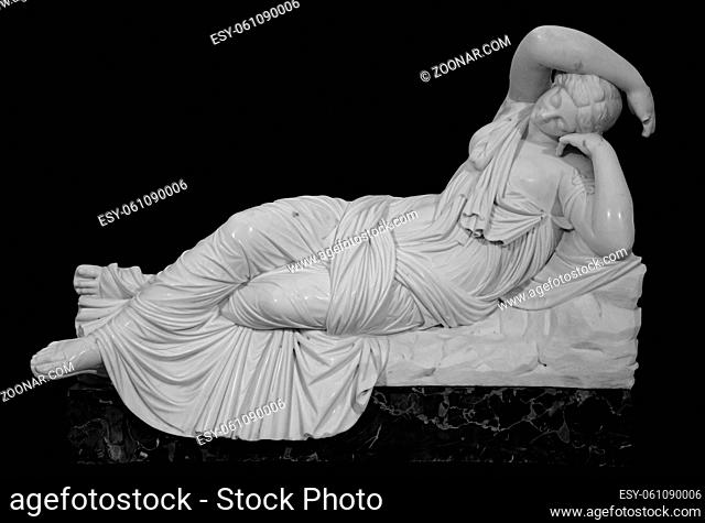 Sculpture The Sleeping Ariadne. Roman Marble statue. Ancient stone white marble woman. Old roman monument . Greek culture exponent in museum