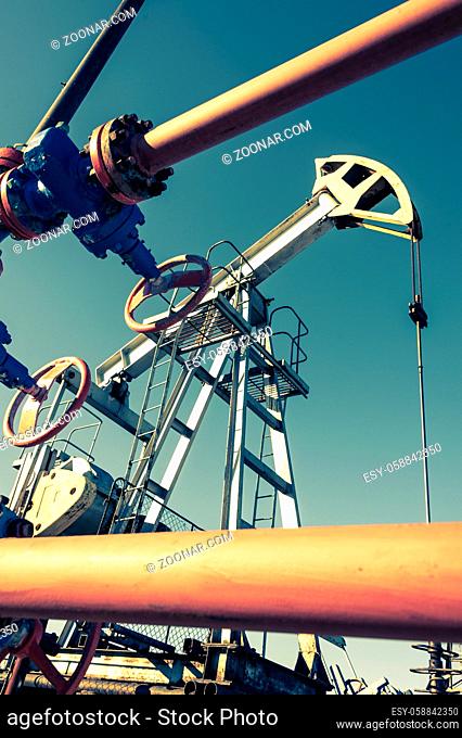 Oil pumpjack, industrial equipment. Rocking machines for power generation. Extraction of oil. Petroleum concept