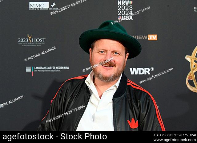 30 August 2023, North Rhine-Westphalia, Cologne: Director Lutz Heineking jr, comes to the evening event on the occasion of the jury session for the...