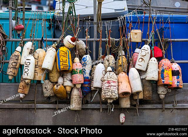 An array of crab pot floats on the side of a commercial fishing vessel in Steveston British Columbia Canada