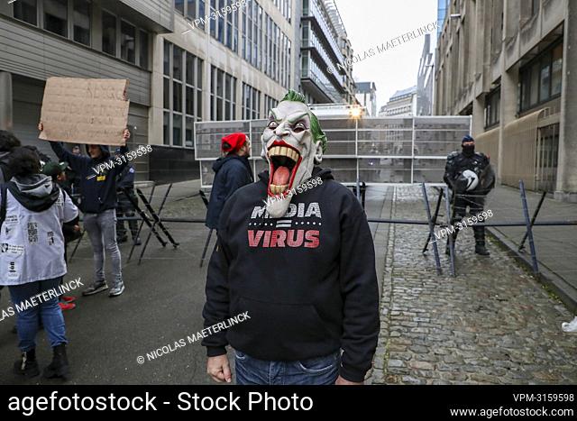 Illustration picture shows a protester wearing a mask of comic book and movie character 'The Joker' during a protest against the health pass (Marche pour la...