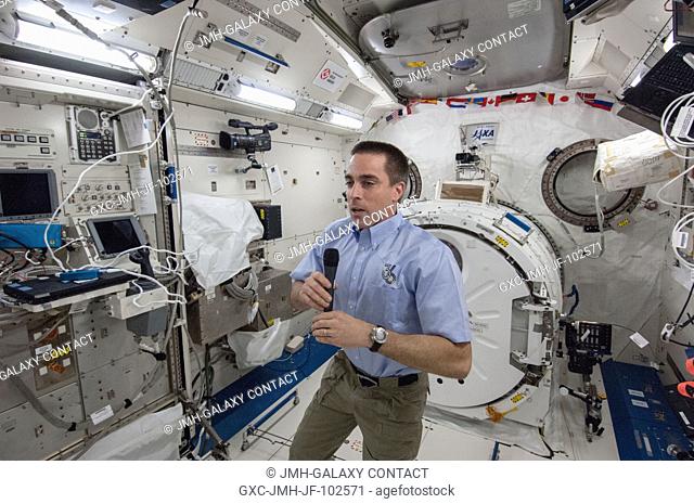 In the JAXA Kibo lab of the International Space Station, Expedition 35 Flight Engineer Chris Cassidy of NASA speaks with an aggregate of Florida students and a...
