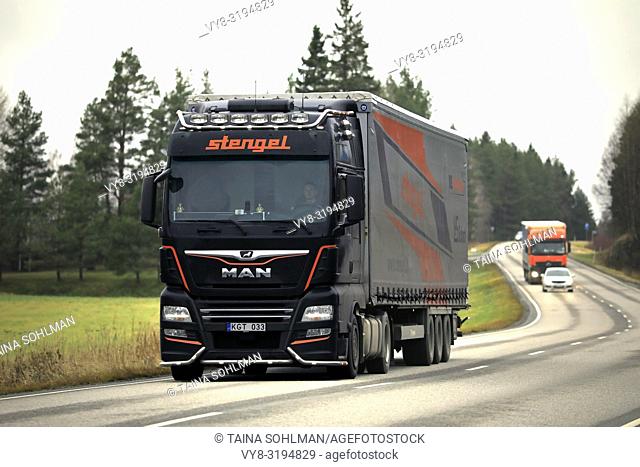 Salo, Finland - November 9, 2018: Customised MAN semi trailer truck of Stengel LT hauls goods in highway traffic in South of Finland on day of autumn