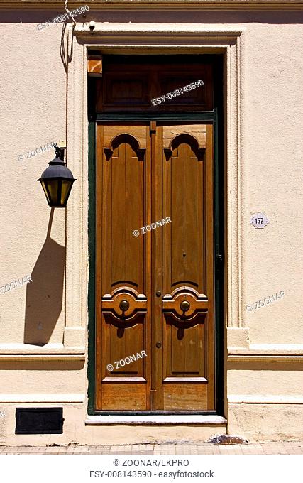 old door and a street lamp in the centre of colonia