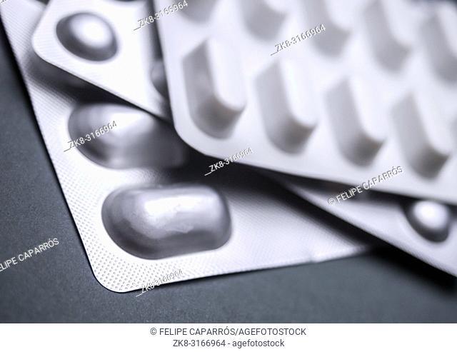 Many Medicines Pills Capsules Of Diferent Size, conceptual image