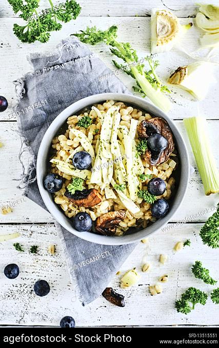 Vegan barley risotto with fennel, mushrooms and blueberries