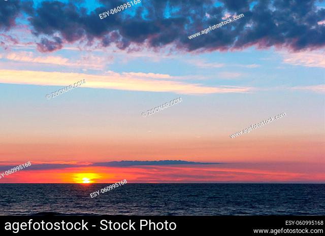 sunset on the Baltic sea, beautiful sunrise and waves on the sea