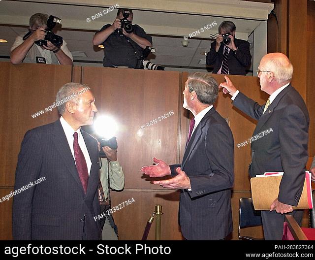 United States Senator Patrick Leahy (Democrat of Vermont) Chairman, US Senate Judiciary Committee, points out several still photographers to Robert S