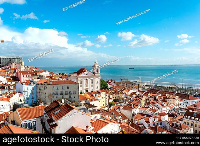 View over the roofs of the Alfama district to the Tagus river in Lisboa. This neighborhood is one of the oldest parts of the capital of Portugal
