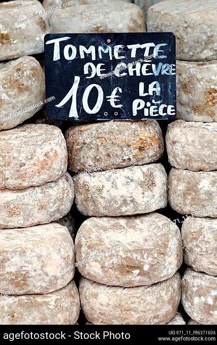 Traditional french cheese for sale at market. Tomme. France