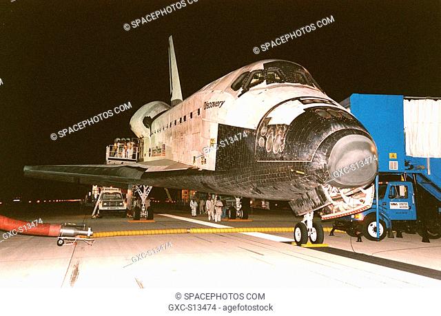 06/06/1999 --- After landing on KSC's Shuttle Landing Facility Runway 15, the Space Shuttle orbiter Discovery is ventilated via the hose running underneath