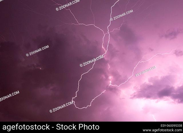 Lightning in storm cloud at night