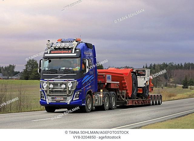 Salo, Finland - November 23, 2018: Volvo FH16 750 semi trailer of Lavettikuljetus Ylitalo & Vahtera Oy hauls Sandvik LH517 underground loader on road