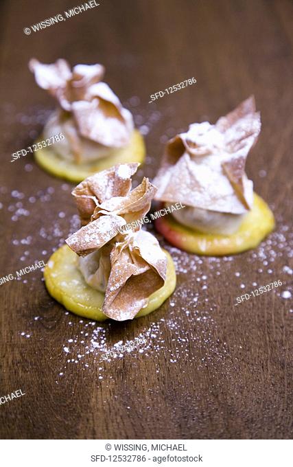 Pear strudel on glazed apple slices