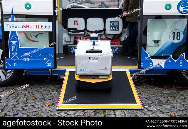 26 November 2020, Schleswig-Holstein, Lauenburg/Elbe: A prototype of a transport robot stands on the ramp of an autonomously driving bus during a press event