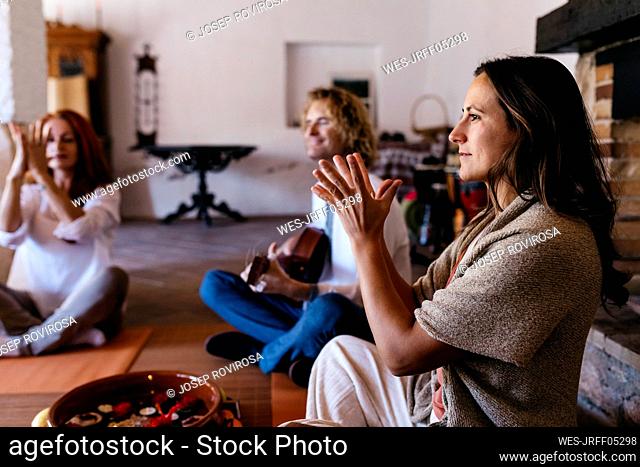 Woman exercising at music therapy in farmhouse