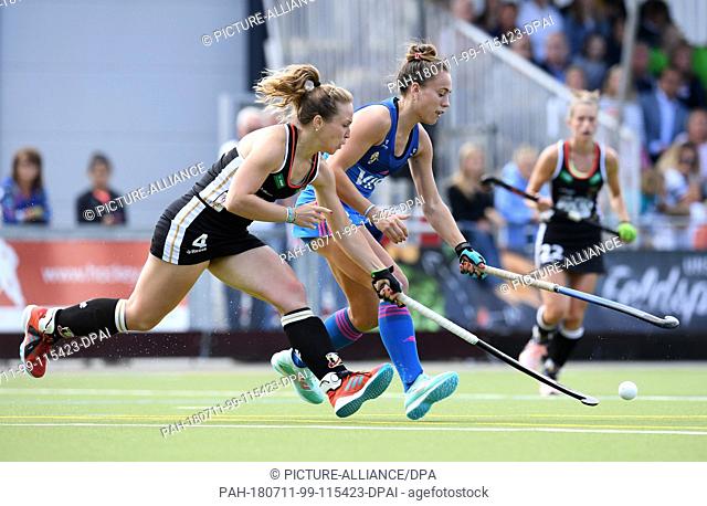 11 July 2018, Germany, Munich: Hockey, Womens: Four Nations Cup, Germany vs Argentina, 1st matchday: Nike Lorenz (L) of Germany and Julieta Jankunas of...