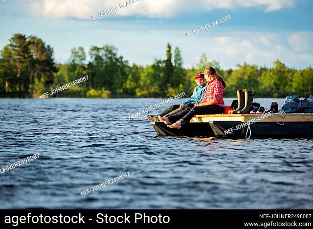 Woman relaxing on motor raft