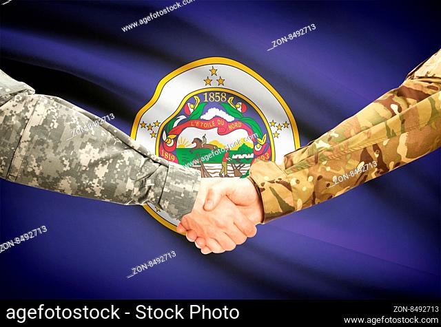 Soldiers handshake and US state flag - Minnesota