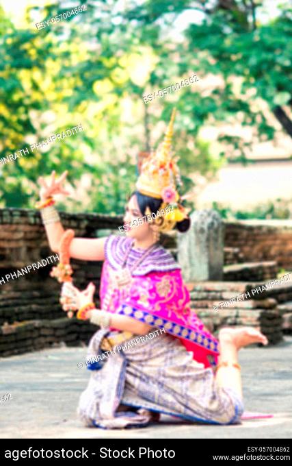 Asian woman wearing typical, traditional Thai Dress. It is literally means ""Thai outfit"", National costume.
