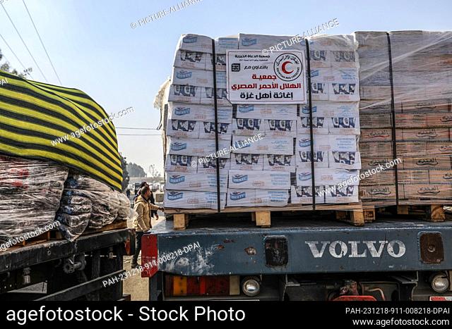 18 December 2023, Palestinian Territories, Rafah: Egyptian Red Crescent aid trucks enter Gaza through the Kerem Shalom commercial crossing