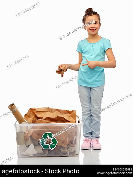 smiling girl sorting paper waste