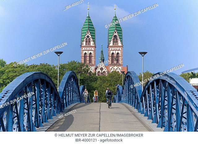 Herz Jesu-Kirche, or Sacred Heart Church, built in the style of Historicism, consecrated in 1897, the Wiwilíbrücke, or Blue Bridge, at front, Freiburg