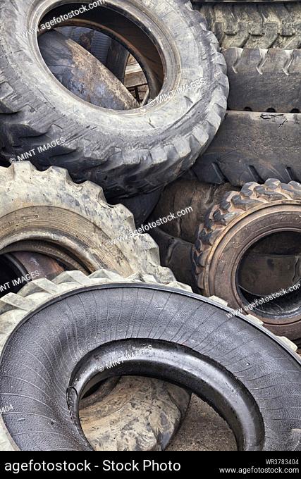 Close up of a heap of old vehicle rubber tyres