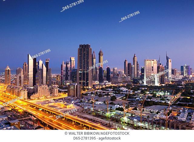 UAE, Dubai, Downtown Dubai, elevated view of skyscrapers on Sheikh Zayed Road from downtown, dawn