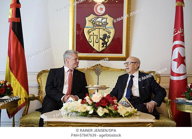German President Gauck and the President of Tunisia Beji Caid Essebsi (R) retire for a brief talk upon Gaucks arrival at Tunis airport, Tunisia, 27 April 2015