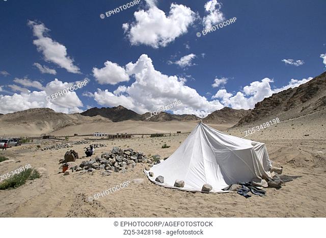 Pitched tent with mountain backdrop, Leh Ladakh, India