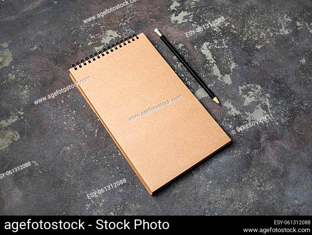 Blank kraft notebook and pencil. Blank branding template. Mock-up for design presentations and portfolios