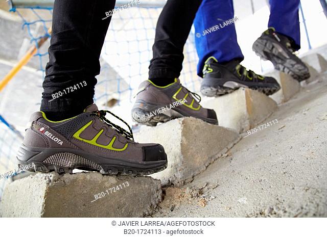 Construction worker with safety boots equipped, House Construction, Basque Country, Spain