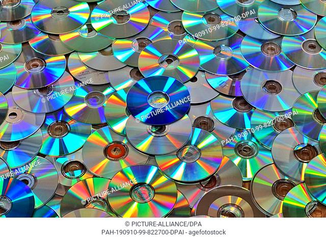 19 August 2019, Berlin: CD discs recorded with music or data are lying on the floor before disposal. Less and less data is stored on physical removable media