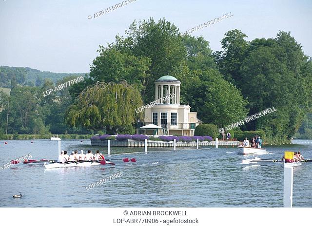 England, Oxfordshire, Henley-on-Thames, Two boats racing from Temple Island which marks the start of the course at the annual Henley Royal Regatta