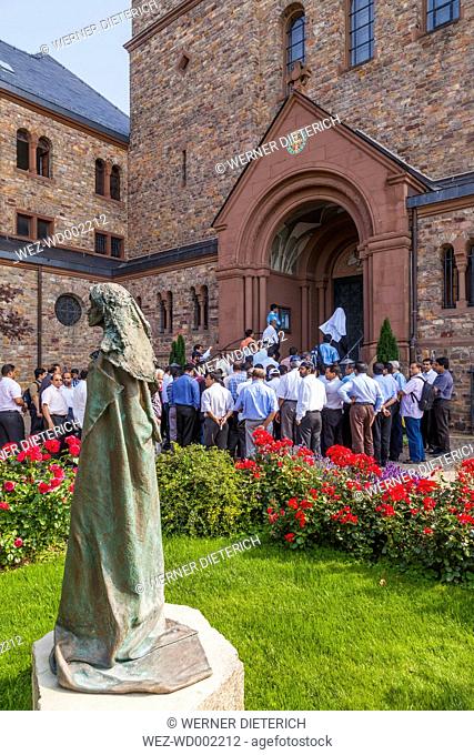 Germany, Hesse, Ruedesheim, St. Hildegard's Abbey, conventual church, visitors and statue of Hildegard of Bingen