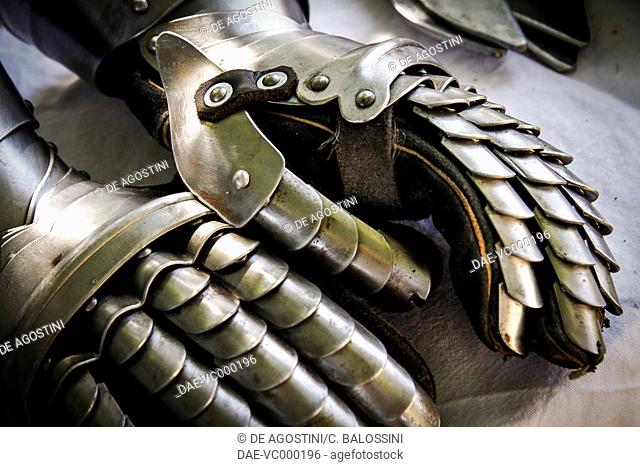 Gauntlets with jointed iron protective covering, part of armour worn by infantrymen in battle, 15th century. Historical reenactment