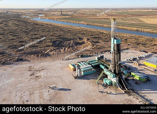 Loving, New Mexico - An oil drilling rig along the Pecos River in the Permian Basin. The Permian Basin is a major oil and gas producing area in west Texas and...