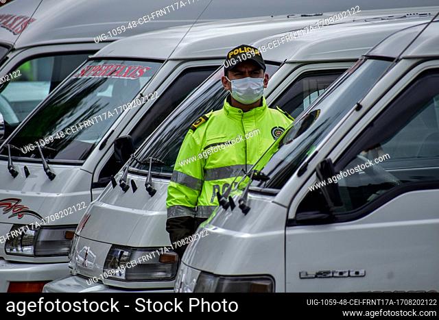 Colombia's police guard protests as drivers of public service vehicles hold protest on the Rumichaca International bridge that conects the countries of Colombia...